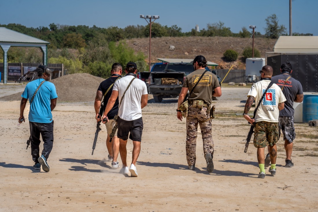 A corporate group on a private machine-gun range team building day near Houston